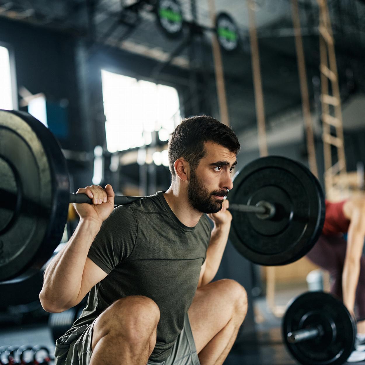 Man lifting weights at gym